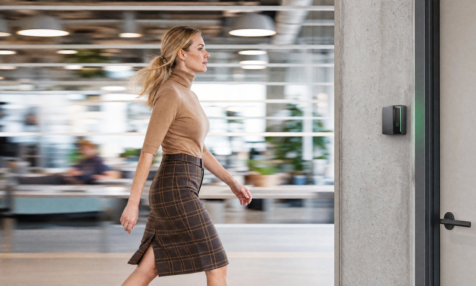 Woman entering an office through a doorway equipped with Rock X