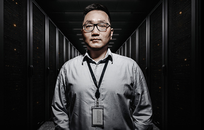 Badge-wearing employee in a server-room access setting