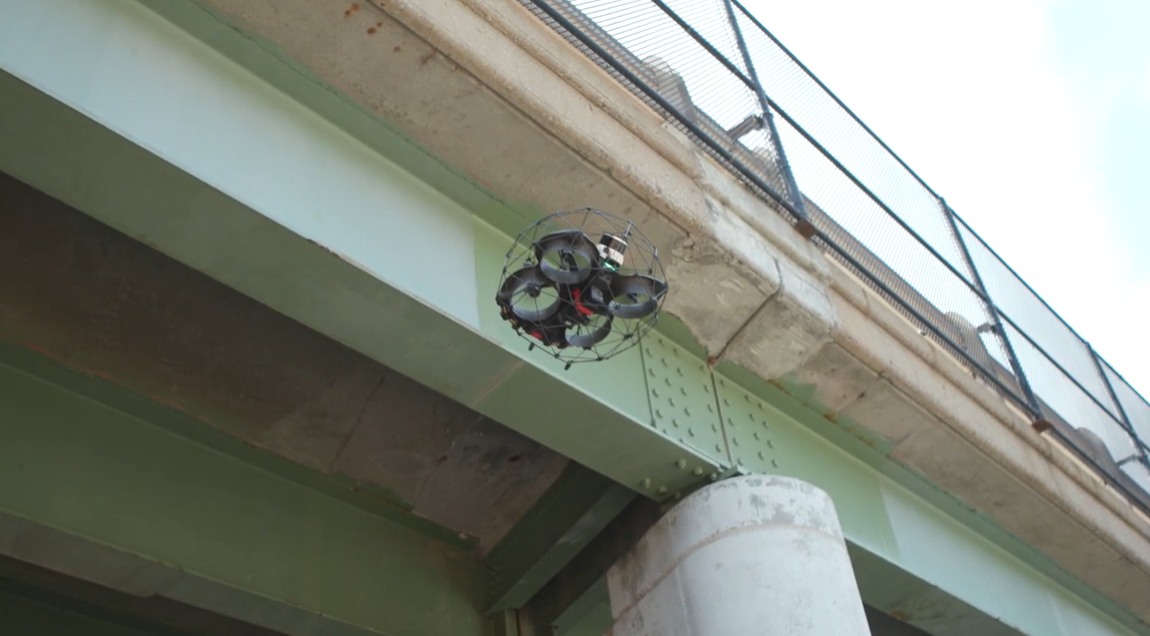 Flyability source photograph showing Elios inspection equipment beneath bridge infrastructure, accompanying the Gedeon GRC case study.